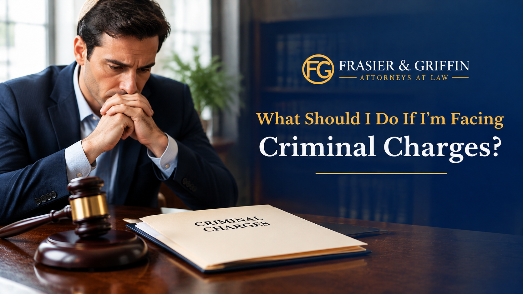 Man reviewing criminal charges with legal documents and gavel during a consultation with Frasier & Griffin Attorneys at Law