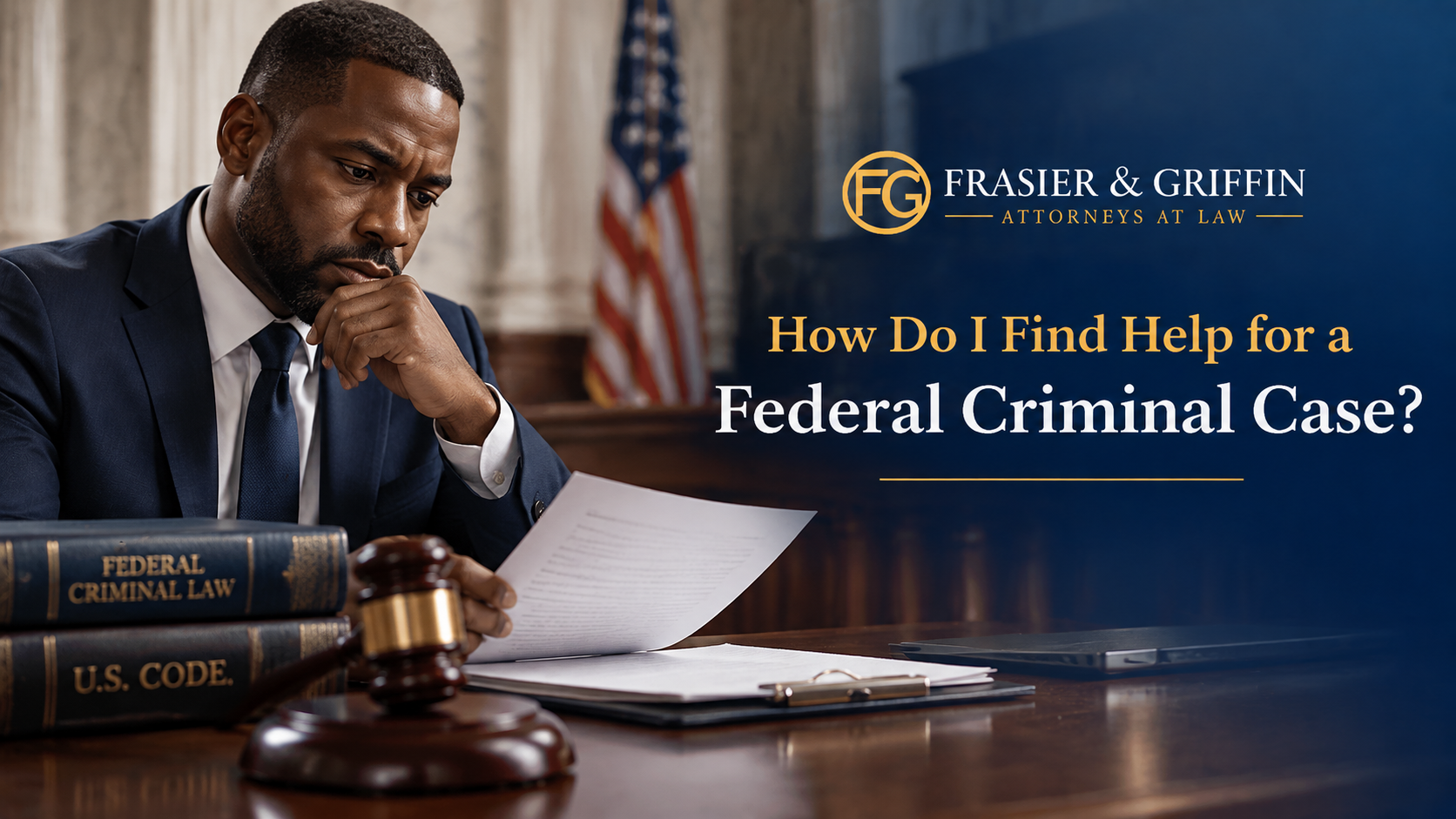 Black man reviewing federal criminal case documents with a gavel and legal books representing federal criminal defense services from Frasier & Griffin Attorneys at Law